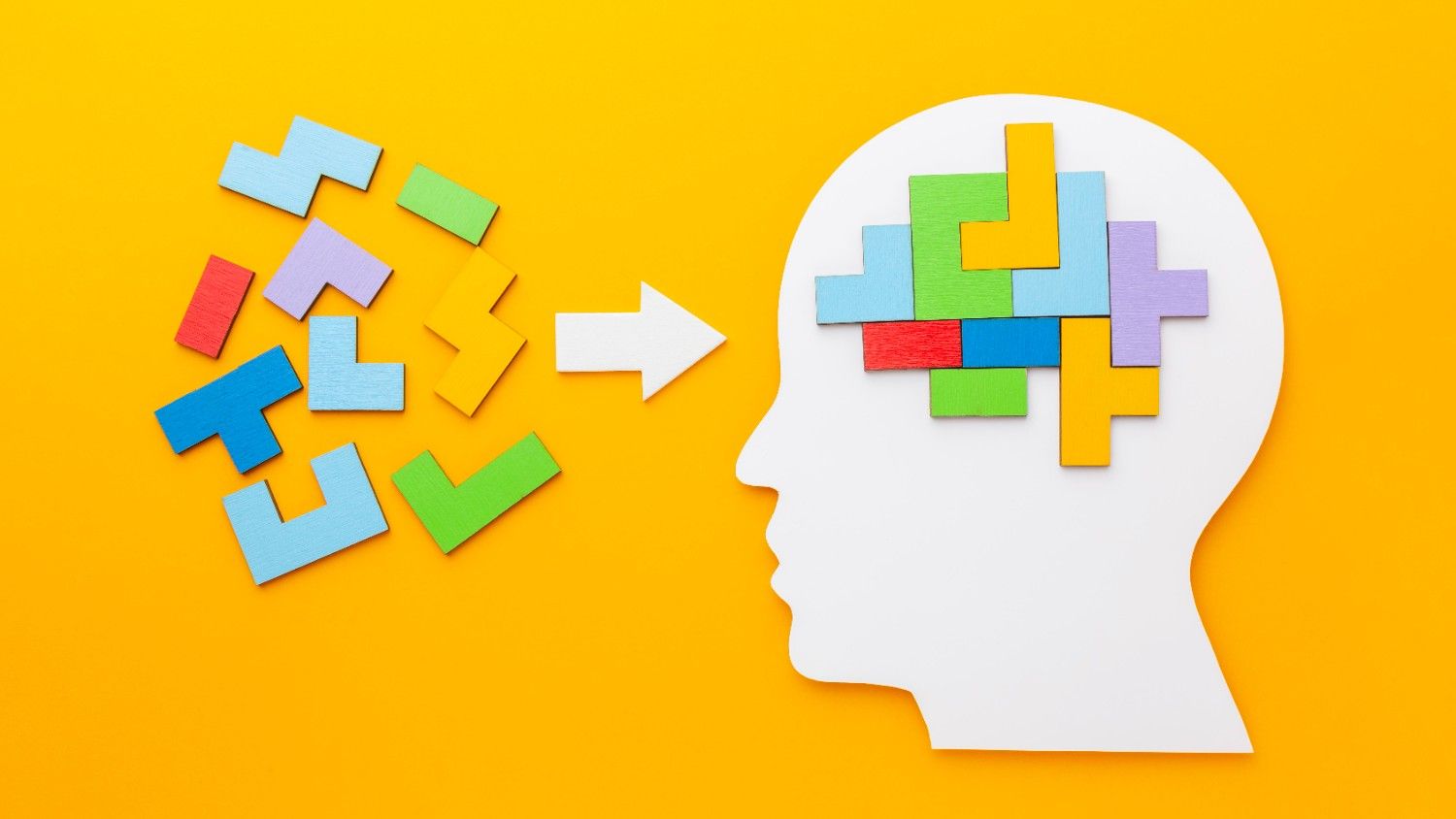 Colorful puzzle pieces forming a brain inside a human head cutout, symbolizing brain busters for smart thinkers. Fun & Challenging Brain Teasers for Smart Minds
