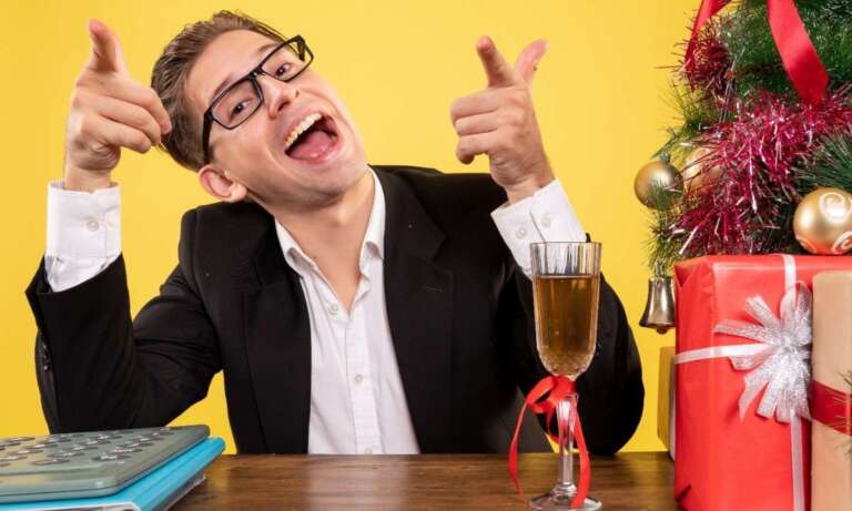 Smiling man laughing joyfully at a festive table, enjoying hilarious jokes and good vibes