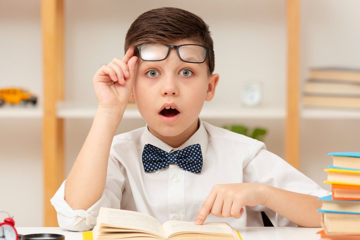 Surprised Child Reading a Book